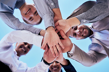 Image showing Business people, hands together and teamwork in unity below blue sky for agreement or collaboration outdoors. Group of employee workers piling hand in team building, motivation or meeting for support