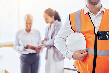 Image showing Architect, safety helmet and meeting for construction planning, collaboration or management at the office. Businessman, contractor or engineer holding hard hat in leadership for architecture project