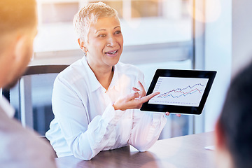 Image showing Senior business woman, tablet and data of graph, chart or statistics in meeting at corporate office. Mature female manager showing company investment, profit or annual target and results at workplace