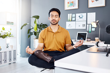 Image showing Yoga, office and business man in lotus pose for mental health and breathing exercise at a desk. Corporate, meditation and asian guy manager meditating for stress management, zen and peace in Japan