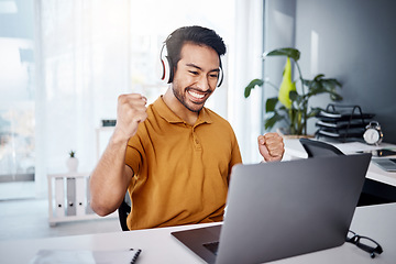 Image showing Business man, laptop and success with headphones to listen to music, audio or video call. Asian male entrepreneur at desk with a smile and hands to celebrate achievement, online target or goals