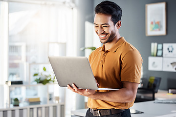 Image showing Laptop, office and happy man for online planning, website design and software management at tech company. Creative asian person, designer or employee on computer or technology for web 3.0 review