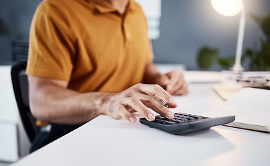 Image showing Calculator, finance and business man hands for financial budget, profit check or accounting in office at night. Person or startup entrepreneur in closeup calculating numbers for taxes, debt or growth