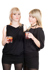 Image showing Two young beauty blonde with cocktails. Isolated 