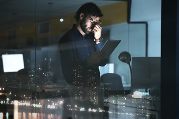 Image showing Business man, tablet and headache, stress or migraine in office by widow with city lights at night. Technology, fatigue and person with depression, burnout or anxiety, pain or brain fog with deadline