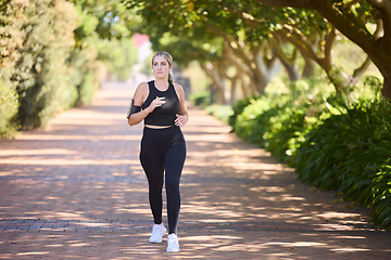 Image showing Music, fitness or woman running in park training, cardio exercise or full body workout for marathon. Sports, runner or healthy girl athlete exercising on jog streaming audio or radio song in nature