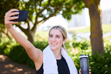 Image showing Park, happy woman or fitness influencer taking a selfie at training, running or workout in a park. Smile, runner or healthy girl athlete in headphones talking pictures or photo to relax on a break