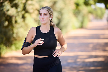 Image showing Music, runner or woman running in park training, cardio exercise or endurance workout for marathon. Sports, fitness or healthy girl athlete exercising on jog streaming audio or radio song in nature