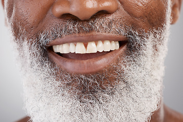 Image showing Mouth, teeth and beard with a senior man in studio on a gray background for beauty, skincare or grooming. Dentist, smile and happy with a person closeup for dental care, oral hygiene or whitening