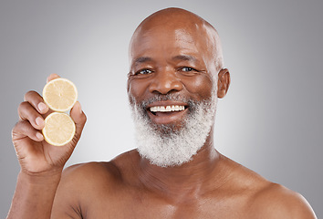 Image showing Senior black man, portrait smile and fruit for vitamin C, skincare or natural nutrition against gray studio background. Happy African American male and citrus lemon for healthy skin, diet or wellness