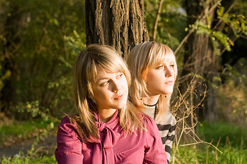 Image showing Two beauty young blondes in the light of the sunset