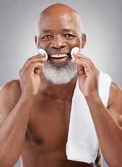 Image showing Skincare, portrait and cleansing pad for man with smile, happiness and grooming with anti ageing facial treatment. Dermatology, cleaning and happy, mature and African model with cotton pads in hands