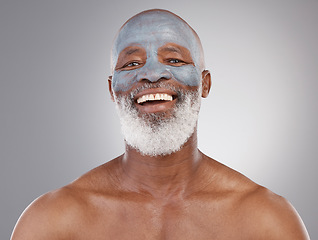 Image showing Skincare, clay mask and portrait of black man with smile, happiness and anti ageing treatment on studio background. Dermatology, cosmetic grooming and happy, mature model in charcoal skin care facial