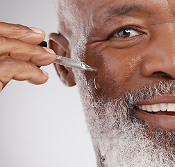 Image showing Skincare, serum and portrait of senior black man in studio for wellness, cosmetics and facial treatment. Dermatology, beauty and face of guy with oil dropper for anti aging, wrinkles and hydration