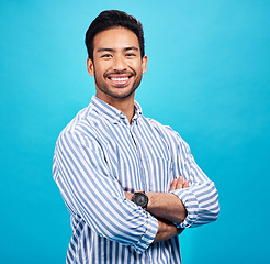 Image showing Portrait of happy man in shirt, blue background and positive attitude with smile on face isolated on studio backdrop. Confidence, happiness and professional male model with pride and mockup space.