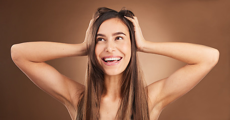 Image showing Beauty, touch and woman with hair care, smile and confident lady against a brown studio background. Female, happy girl or person massage head, scalp and salon treatment with happiness, glow and shine