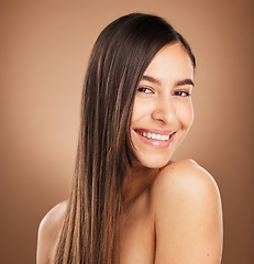 Image showing Hair care, beauty and portrait of woman in studio for wellness, treatment and health on brown background. Salon aesthetic, smile and face of happy girl with cosmetics, hairstyle and natural glow