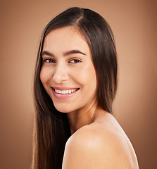 Image showing Hair, happy and portrait of woman in studio for wellness, keratin treatment and healthy style on brown background. Salon aesthetic, smile and face of girl with cosmetics, texture and natural beauty