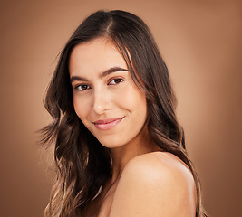 Image showing Portrait, beauty and woman in studio for body care, wellness and cosmetics on brown background. Face, relax and female skincare model smile for luxury pamper, self love and grooming routine isolated