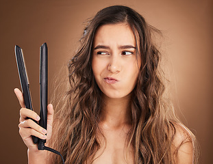 Image showing Hair care, flat iron and damage, portrait of woman on studio background, worried face and salon hairstyle. Haircare problem, electric straightener and frustrated latino model with spa heat treatment.