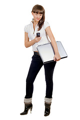 Image showing Businesswoman with laptop and phone over white