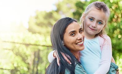 Image showing Portrait, outdoor and mother with girl, adoption and happiness on break, bonding and quality time. Face, mama and daughter embrace, hug and smile with joy, adopted and foster mom with female child