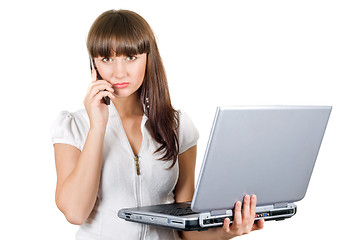 Image showing Businesswoman with laptop speaks on the phone