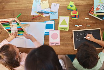 Image showing Learning, education and study with family at table from above for homework, home schooling and child development. Math, lesson and creative with children and woman for knowledge, help and support