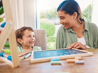 Image showing Chalkboard, mother teaching and child learning math, numbers and home development with happy family, help and support. Woman or mom with kindergarten kid and writing discussion for creative education