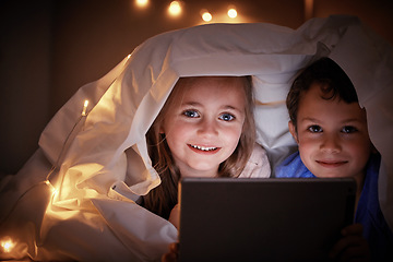 Image showing Portrait, evening and kids in bedroom, tablet and streaming movies with happiness, bonding and quality time. Face, children and siblings online games, blanket and cover with smile, technology and joy