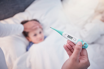 Image showing Parent, hands and thermometer with sick child, flu or fever lying on bed under monitoring care at home. Hand of adult checking temperature of kid for illness, healthcare or virus in love and support