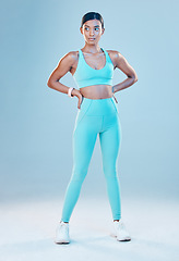 Image showing Thinking, active and a woman for fitness in gymwear isolated on a studio background for exercise. Idea, sports and an Indian girl standing in workout clothing for training or a cardio idea for health