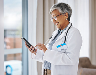 Image showing Woman doctor, phone and happy in hospital for communication, online consultation or research. Medical professional female with smartphone internet for advice, healthcare and innovation on mobile app