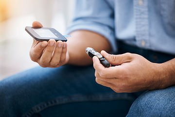 Image showing Hands, diabetes and measurement with a man in his home holding a blood glucose meter for disability awareness. Healthcare, medical and sugar with a diabetic male testing insulin levels in his house