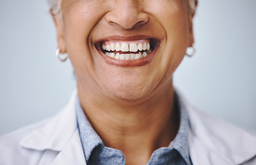 Image showing Dental, smile and elderly woman in studio for mouth, hygiene and denture care against grey background. Teeth whitening, cleaning and senior lady happy for oral, tooth and natural looking veneers