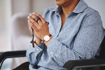 Image showing Praying hands, rosary and woman in a wheelchair in prayer, worship and praise closeup. God, pray and female asking, hope and relief of disability, thankful and gratitude to Jesus, faith and guidance