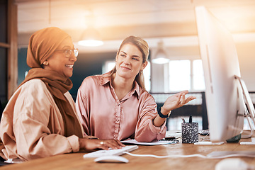 Image showing Talking, women and training for business on a computer for advice, help and corporate collaboration. Happy, diversity and Muslim employee with a manager speaking, mentoring and helping with pc work