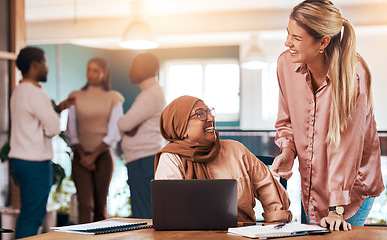 Image showing Business people, laptop and happy mentor talking to muslim woman at office desk for motivation. Entrepreneur women laugh in office for discussion about coaching, management and planning or training