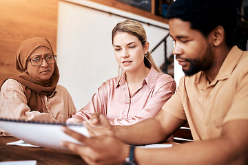 Image showing Creative business people, meeting and documents in planning, collaboration or project design at the office. Group of employee designers discussing paperwork, strategy or ideas together for startup