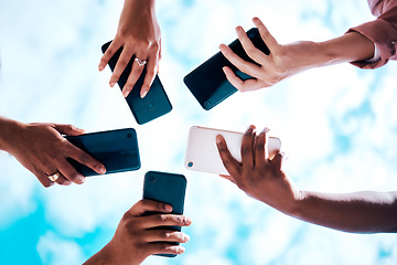 Image showing Connection, below and hands with phone on a blue sky for social network, communication and sharing. Bluetooth, friends and group with mobile for an app share, cloud computing and circle networking