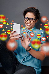 Image showing Smile, love emoji or happy woman with a phone for communication, social media texting or online dating. Graphic overlay or relaxed girl on mobile app website or digital network with heart emoticons