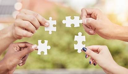 Image showing Closeup group of people, hands and puzzle for teamwork, solution and problem solving for innovation. Team building game, jigsaw piece and collaboration of cooperation, synergy or planning integration