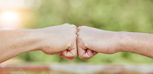 Image showing Closeup of people, hands and fist bump for success, teamwork and greeting outdoors. Friends, community and bumping hand for collaboration, motivation and trust of solidarity, support and cooperation