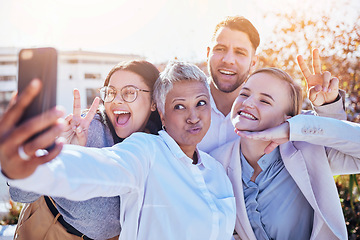 Image showing Selfie, silly group of business people and team building outside office, happy employees at creative start up. Diversity, happiness and smile, man and women in outdoor picture together at workplace.