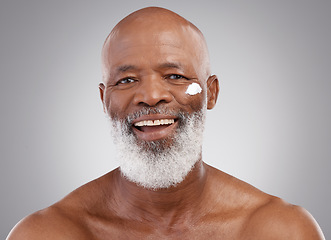 Image showing Skincare, cream and portrait of senior black man in studio for wellness, cosmetics and facial creme. Dermatology, beauty and face of happy guy with anti aging lotion, wrinkle treatment or moisturizer