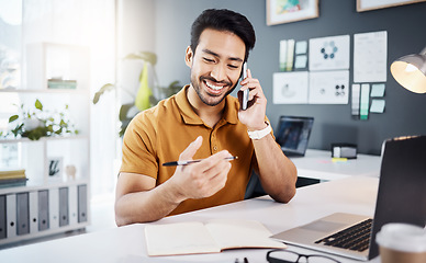 Image showing Phone call, happy and strategy with a business man chatting while working at his desk in the office. Mobile, contact and communication with a young male employee chatting or networking for planning