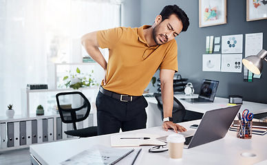 Image showing Back pain, business man and stress at office desk with an injury and depression. Asian male entrepreneur frustrated with body ache, mental health and burnout or fatigue problem and tired of working