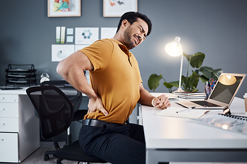 Image showing Back pain, business man and stress at night at office desk with injury and health problem. Asian male entrepreneur with technology, mental health or burnout while tired or fatigue and working late