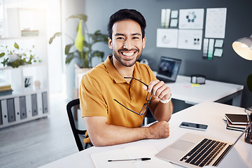 Image showing Happy, smile and portrait of a businessman in the office while working on a project with a laptop. Confidence, leadership and professional male employee planning a company report in the workplace.