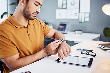 Image showing Time check, notification and businessman with a watch at work for a project deadline or schedule. Technology, office and an Asian employee setting a timer, reading a message or communication on tech